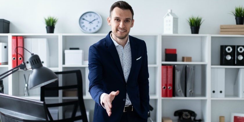 Man reaching out to shake hands