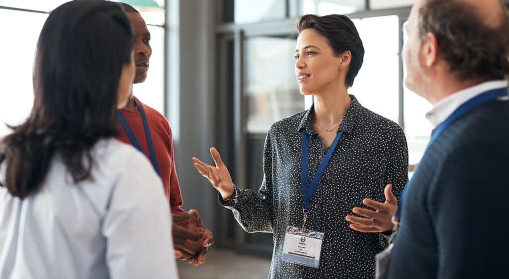 A group of professionals networking at a conference