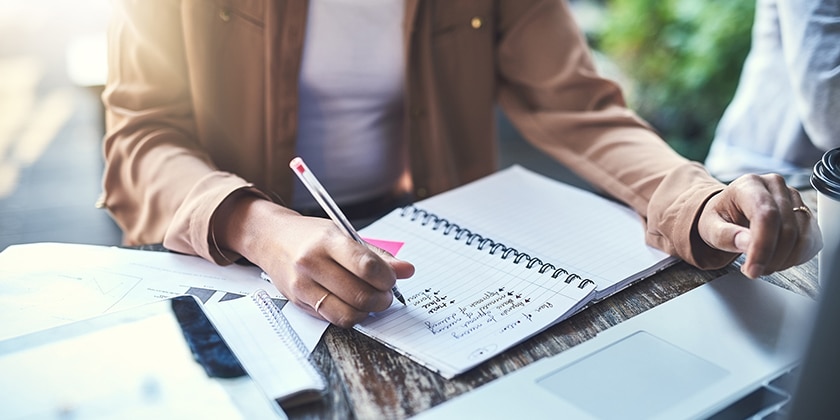 Person writing in a notebook