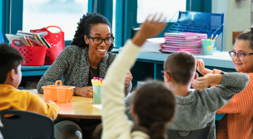 substitute teacher sharing lesson plans with elementary students